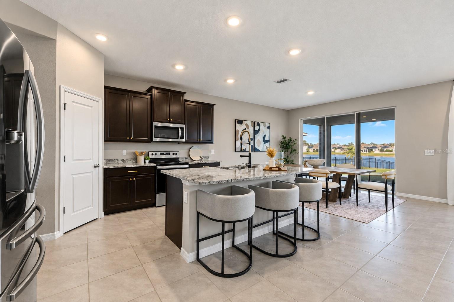 Kitchen island and dining connection - 5126 Jackel Chase Dr, Wimauma