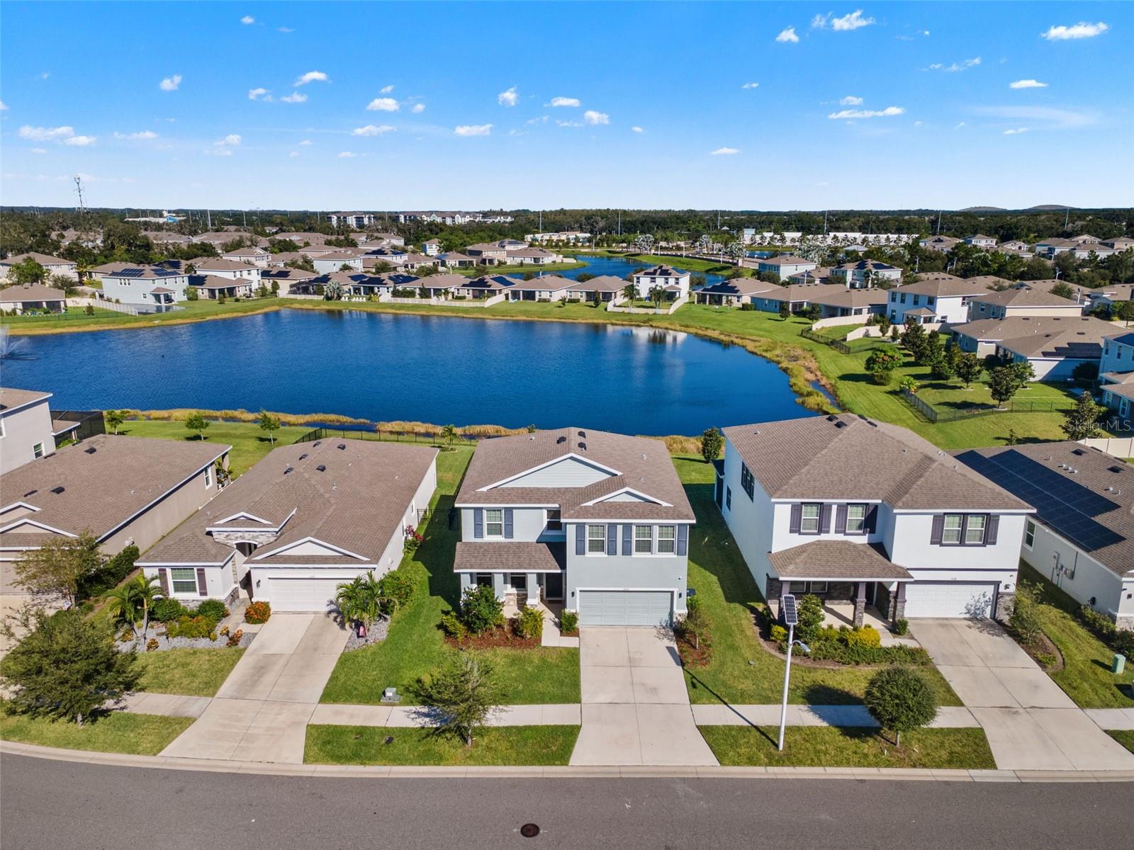 Front aerial with pond backdrop - 5126 Jackel Chase Dr, Wimauma
