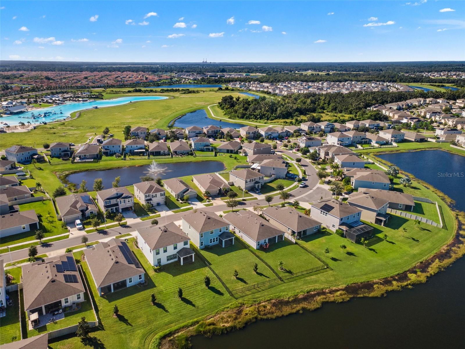 Rear neighborhood aerial with lagoon context - 5126 Jackel Chase Dr, Wimauma