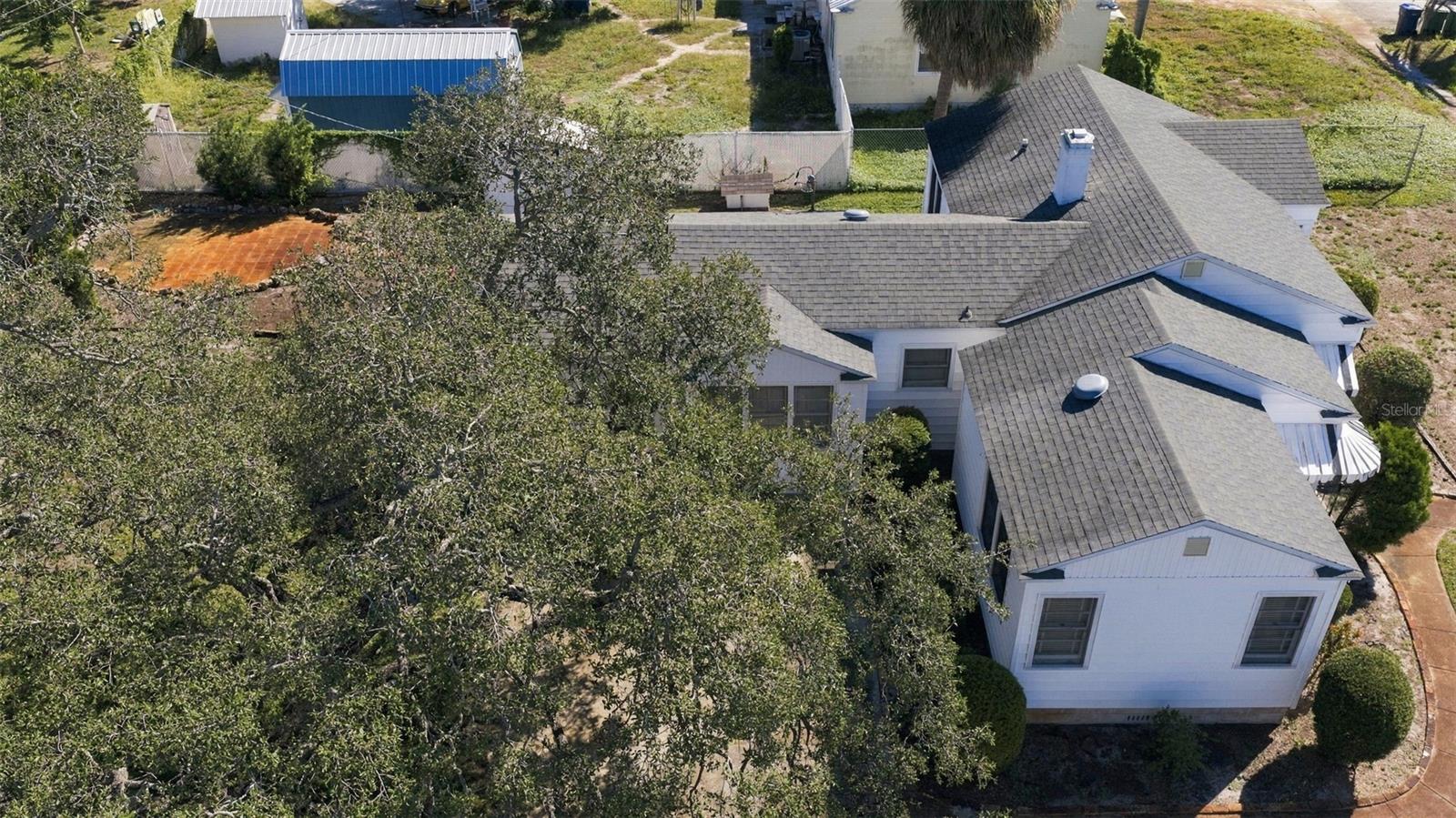 Overhead West side of house and driveway looking east