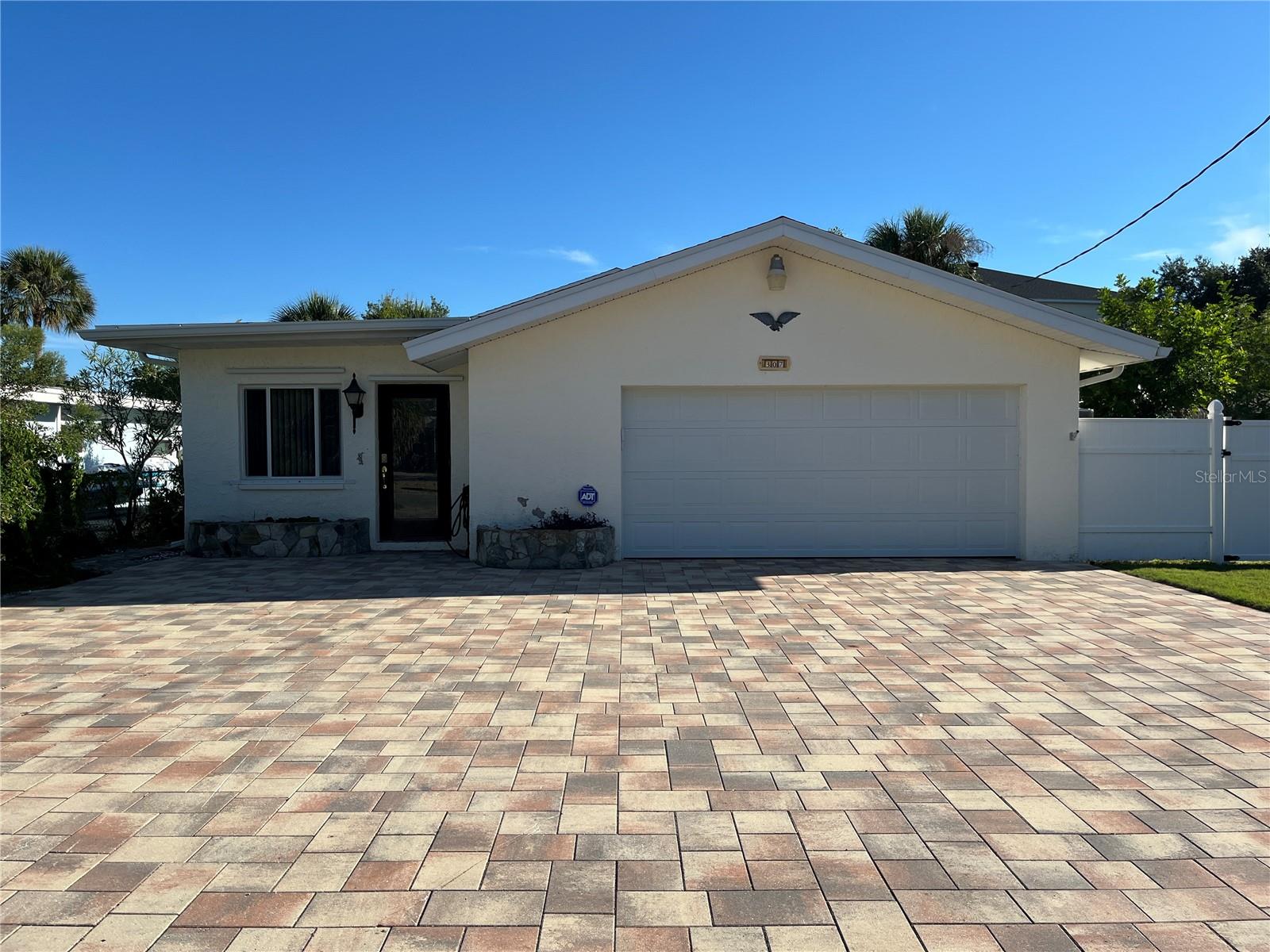 Front exterior of the home with plenty of paved parking Front exterior of the home with plenty of paved parking