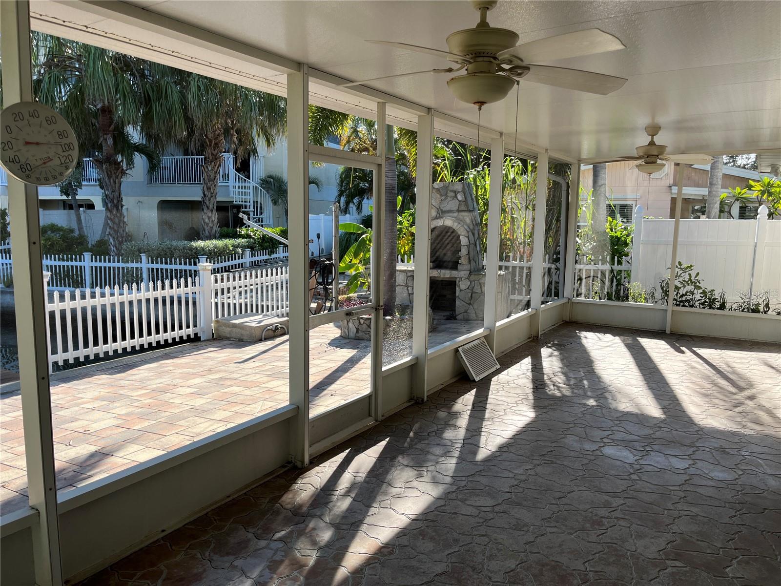 Outdoor covered patio with ceiling fan