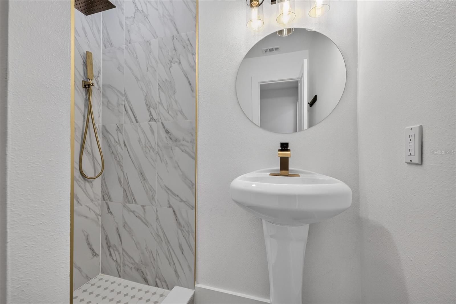 Thoughtful updates and contemporary details bring a fresh, modern feel to this private ensuite bathroom.