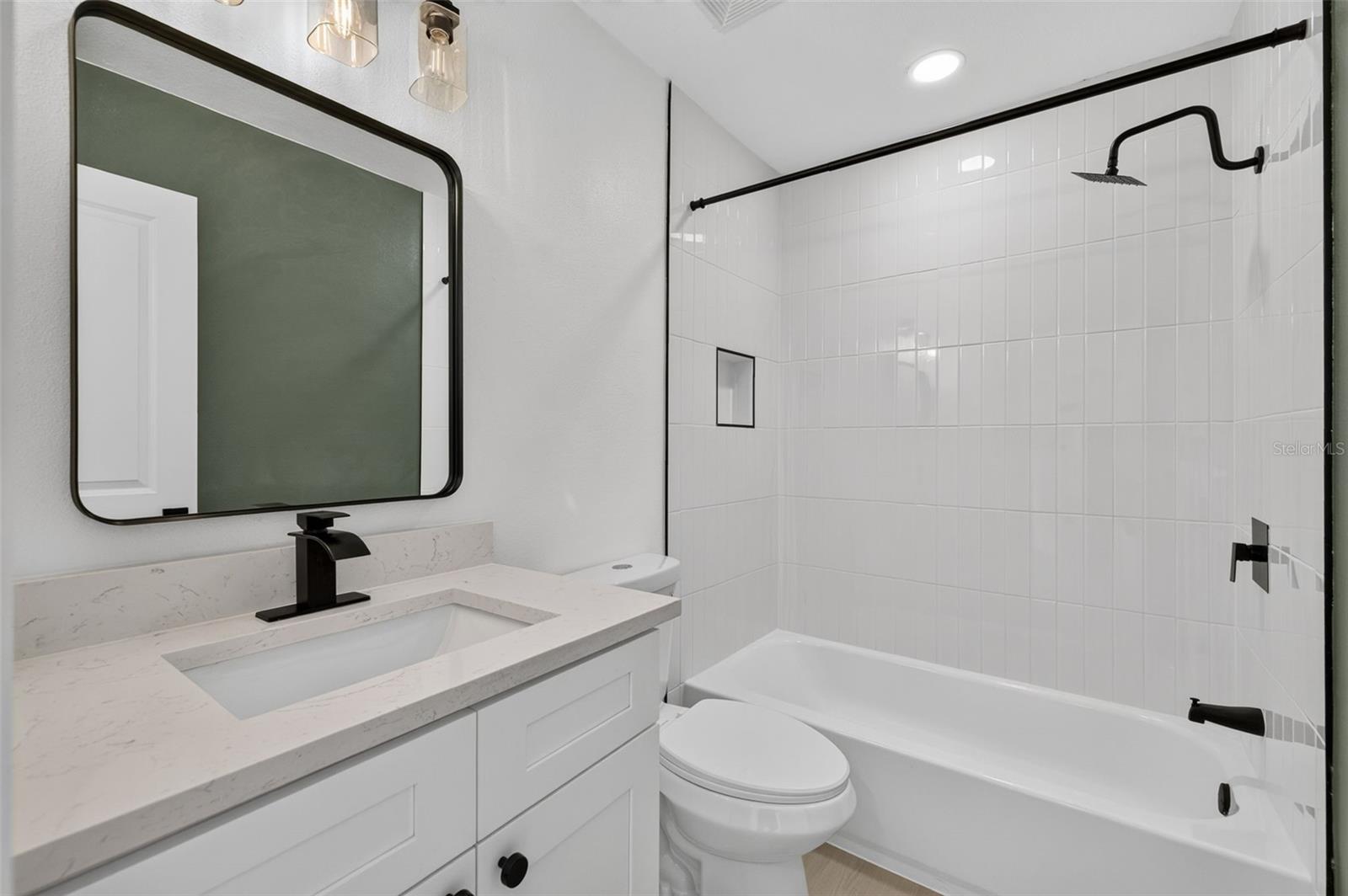 Conveniently located guest bathroom with a clean, functional layout.