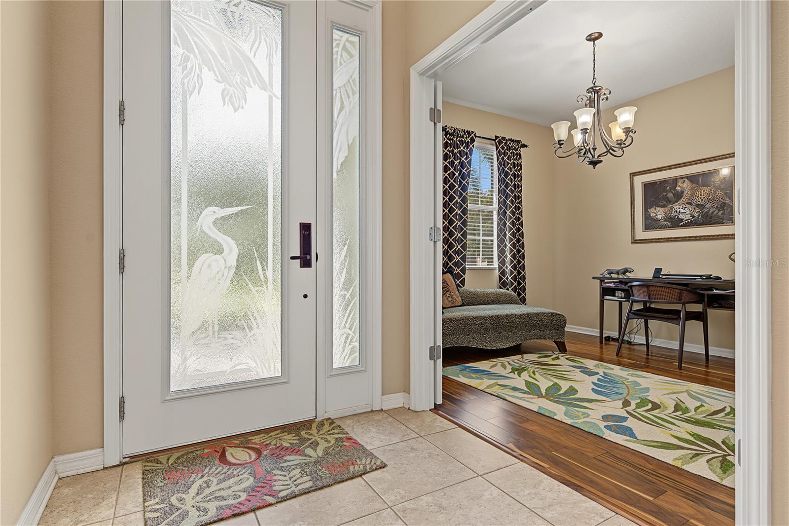 Leaded glass front entry door with sidelight adds natural light