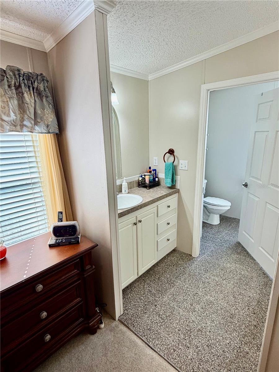 Primary Bathroom suite, features double sinks and walk in shower