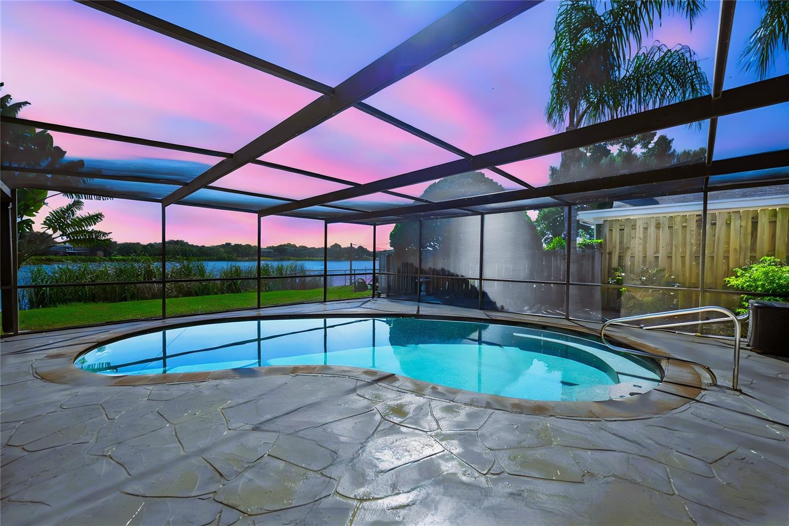 Relax is your private salt water pool safe from mosquitos in your screen enclosed retreat overlooking the Lake