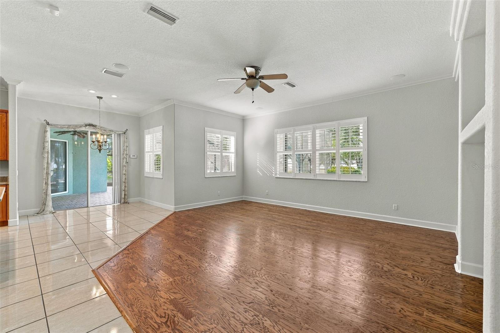 Breakfast Nook & Slider out to Pool/Spa! Great Room in Real Wood Flooring!  Crown Molding & Plantation Shutters!