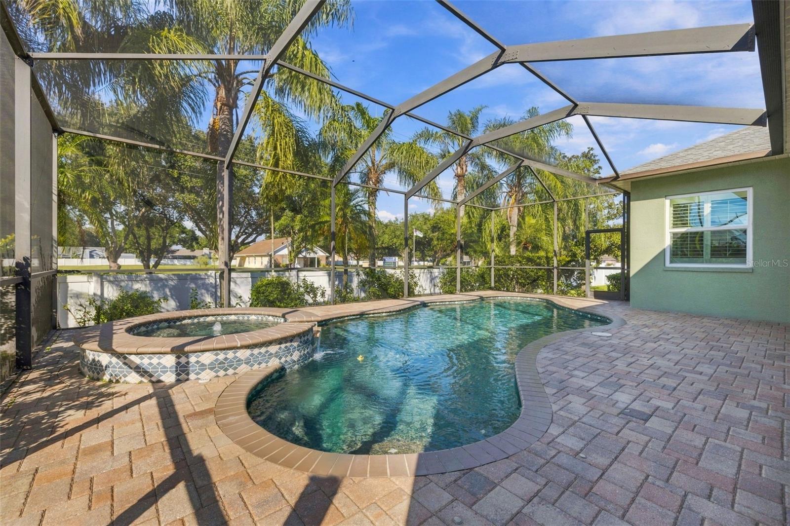 Paver Pool and Spa area is fully Caged/Screened for your bug free enjoyment!