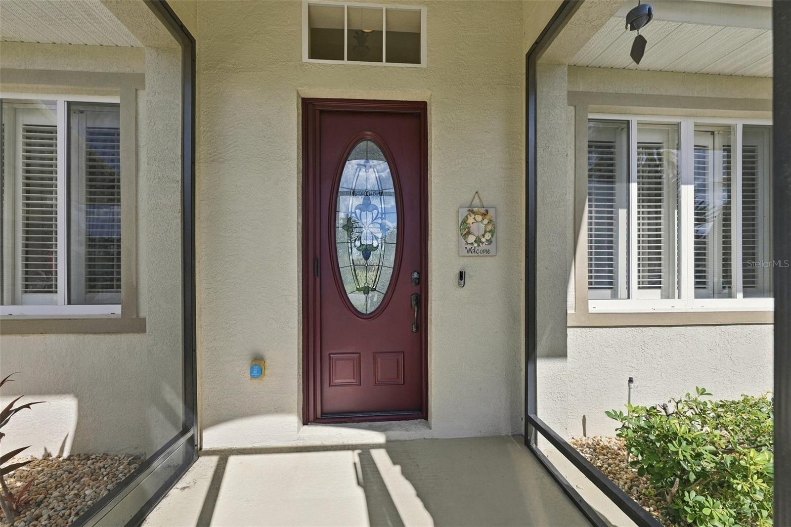 The front screen porch offers protection from the elements and security for packages. The lovely stain-glass paneled door brings light and beauty into the home. The front screen porch offers protection from the elements and security for packages. The lovely stain-glass paneled door brings light and beauty into the home.