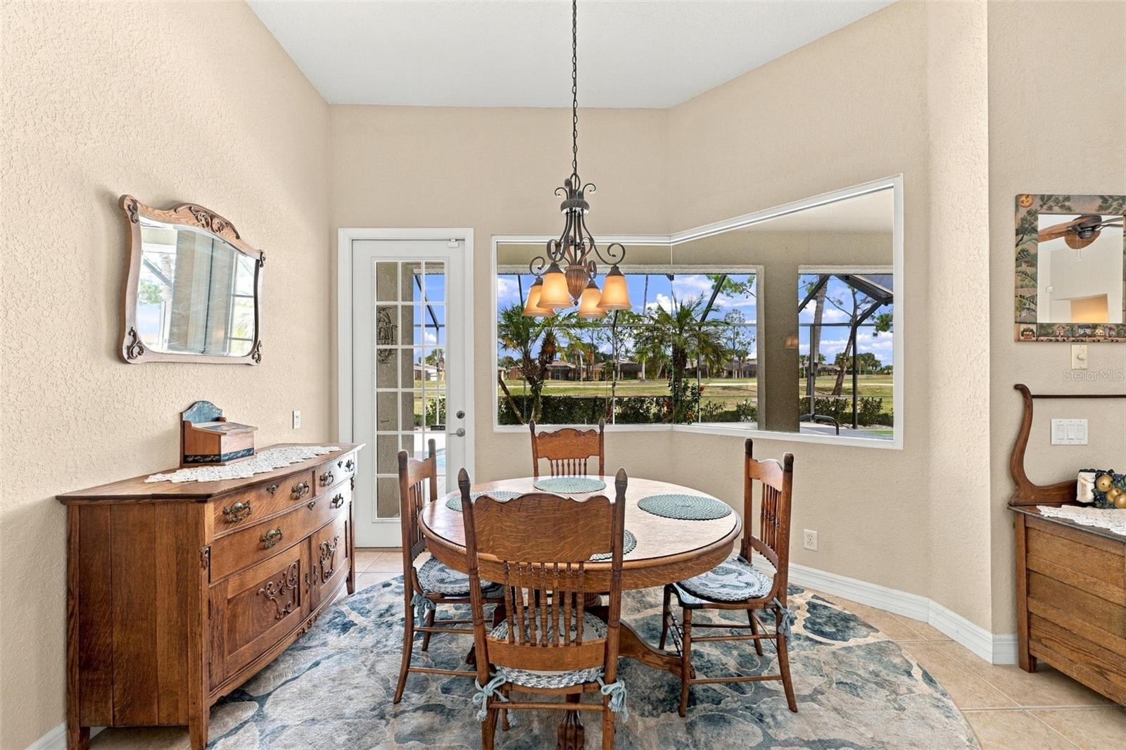 This dinette is perfect for morning coffee and enjoying the full beauty of this home.  A stunning corner window adds aesthetic appeal and the ability to provide panoramic views and increased natural light.