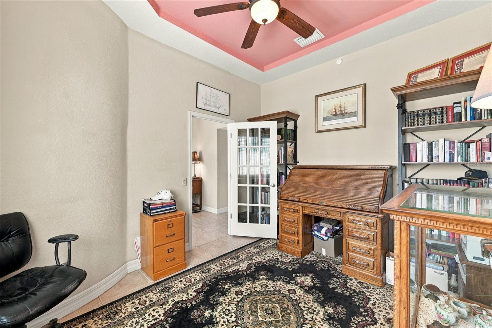 A large office, craft room, or 4th bedroom is a wonderful surprise in this home.  The glass French door allows a lot of natural sunshine into the room.