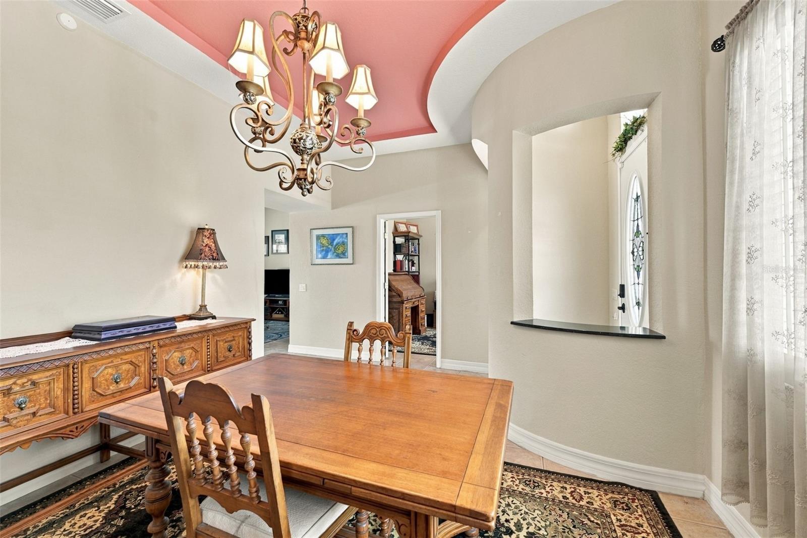 If you don't need a dining room, this room is perfect as a music room, elegant living room or library, due to it's unique architectural features.