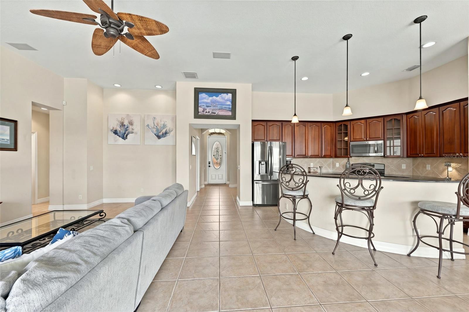 Open, bright and spacious with high ceilings and contemporary light fixtures.