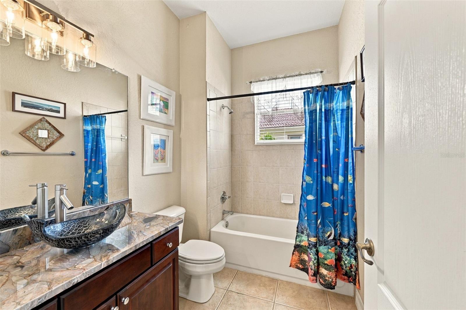 The guest bathroom is just outside the door of Bedroom #2 for privacy.  Unique, modern and well appointed.