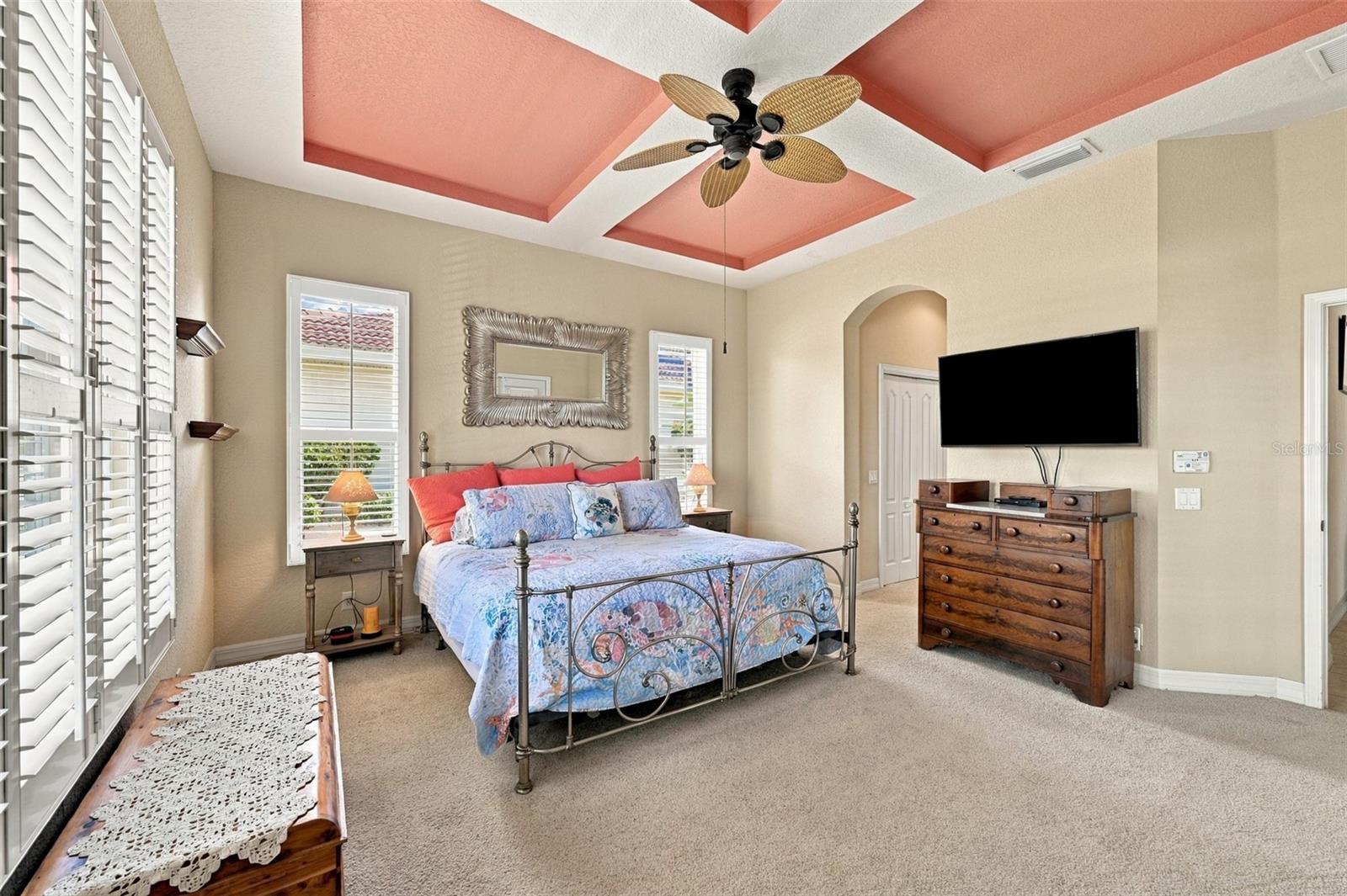 The bedroom is in a corner of the house for maximum privacy with an ensuite bathroom and two walk-in closets.