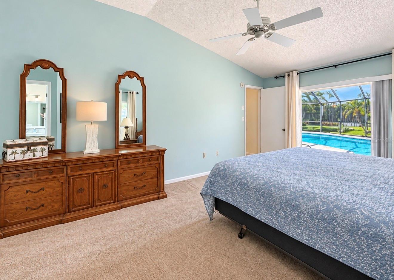 Primary bedroom leads to pool lanai