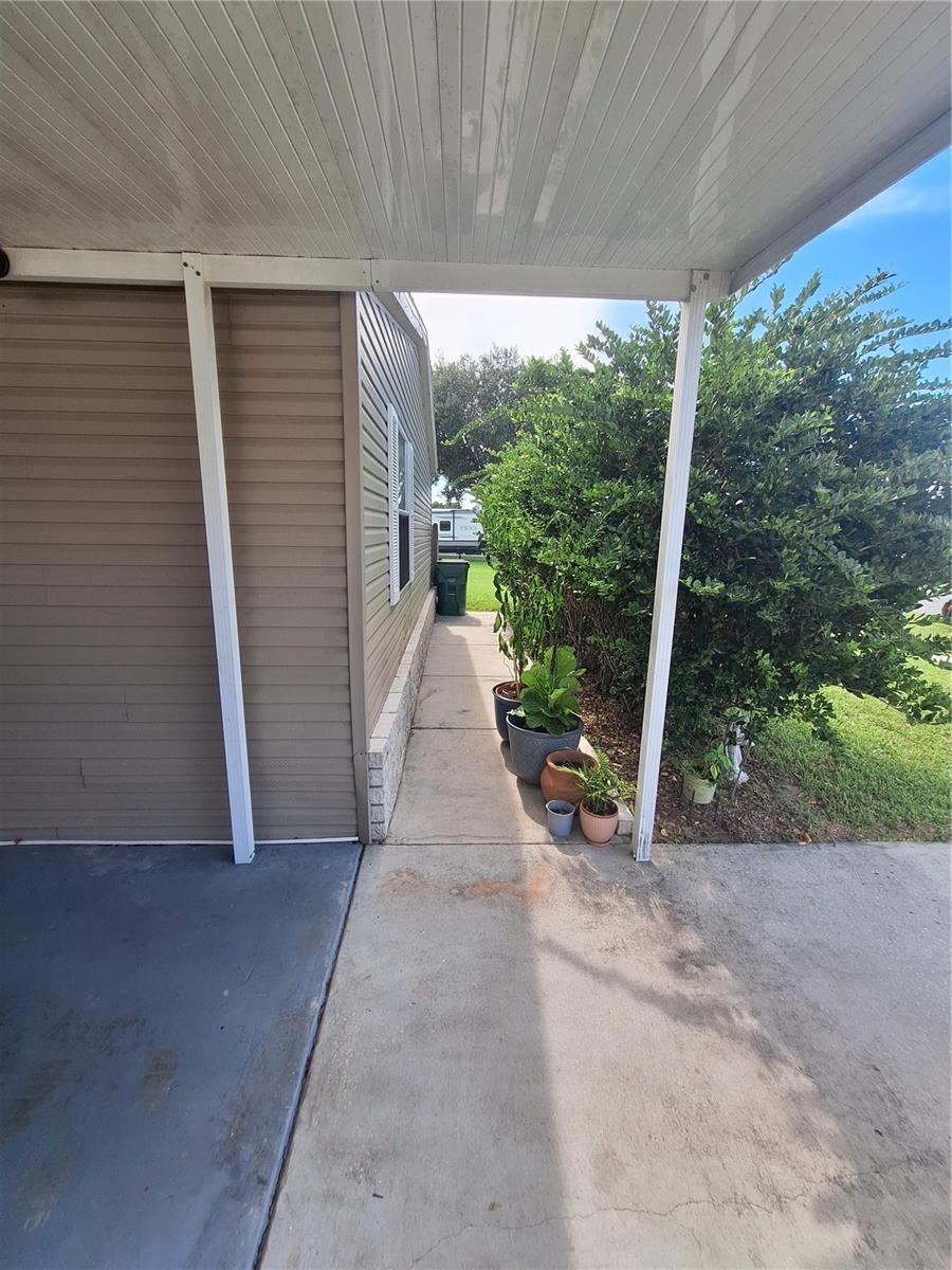 Walkway behind the front landscaping to the side and bank yard.