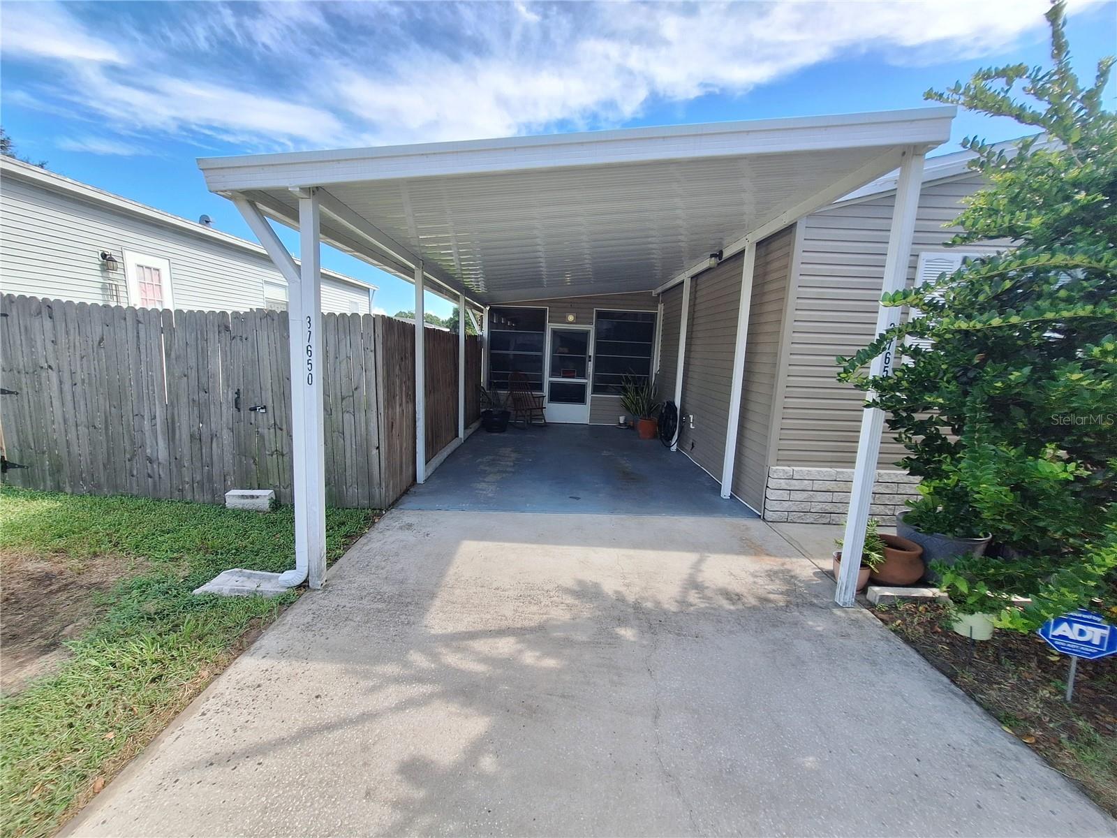 The door in the carport leads into the Florida Room.