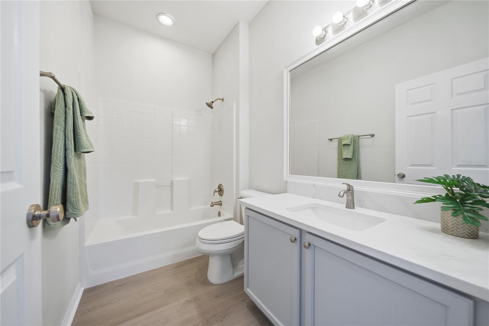 Beautifully updated with new paint, new flooring and a quartz counter top!