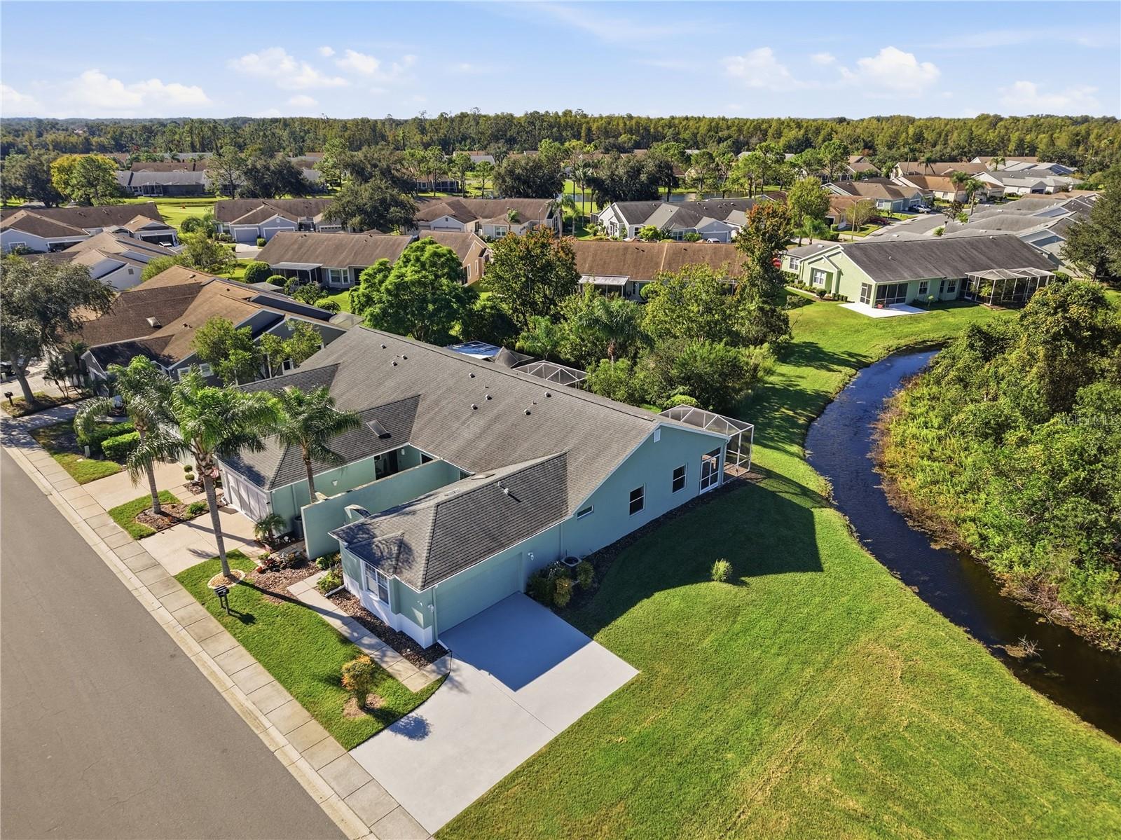 Arial view of this end unit with an amazing driveway with plenty of space for your dinner parties & guests parking