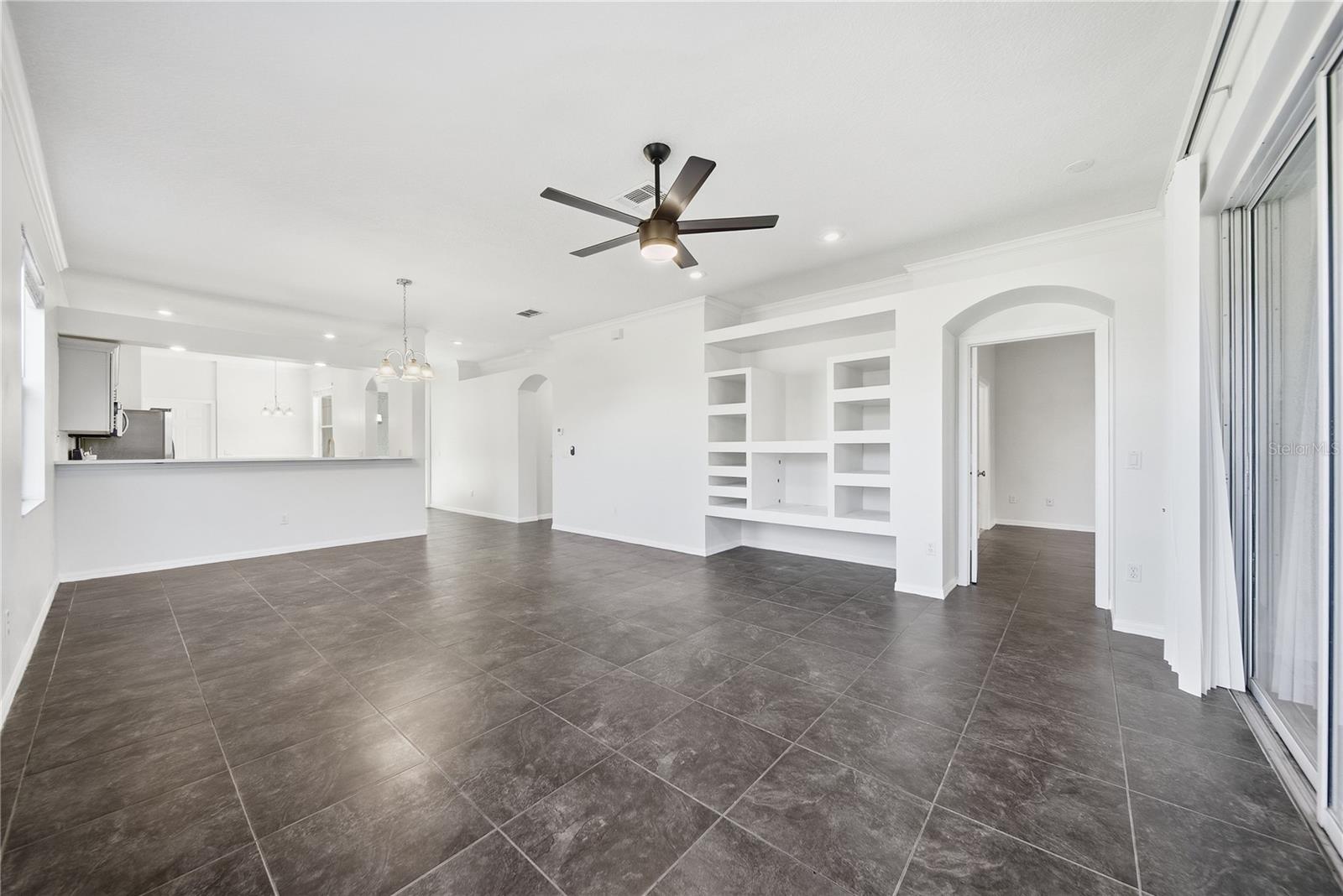 Bright and airy living room with built in shelves