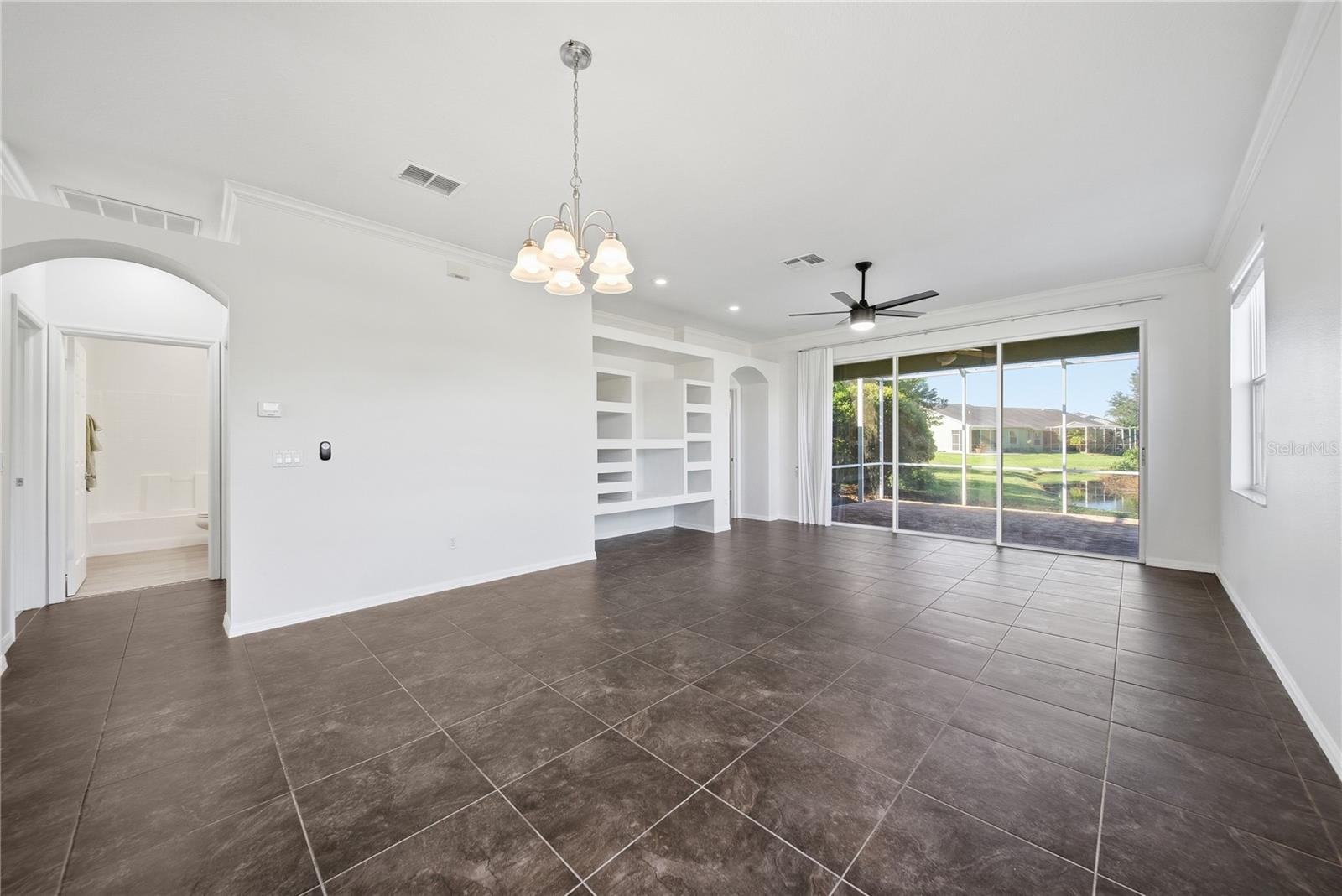 Your view out into your lanai with preserve and a small stream running through in back.