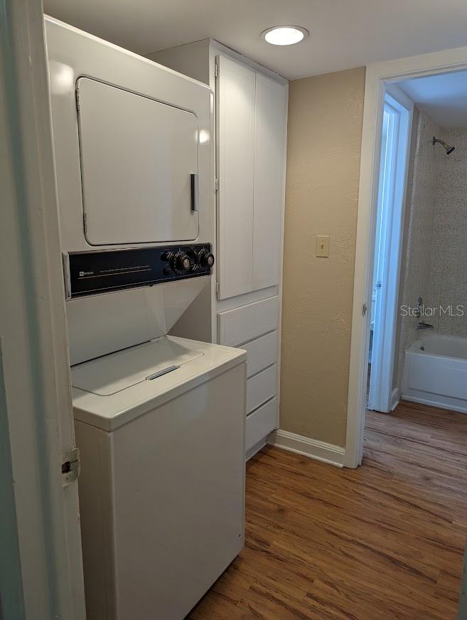 Laundry space with bult in storage connects to bath and to kitchen