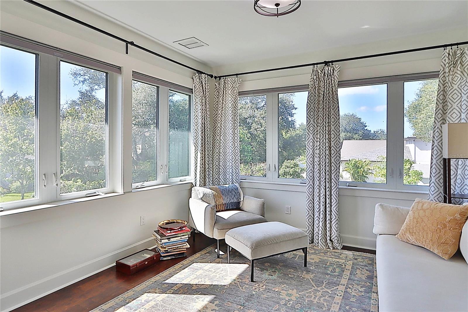 natural light  abounds in the sitting area of primary suite