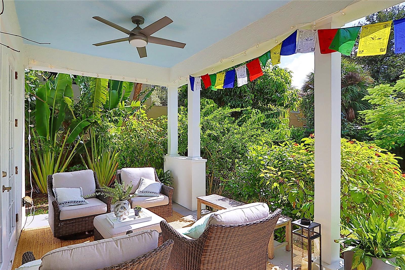 covered porch with beautiful backyard