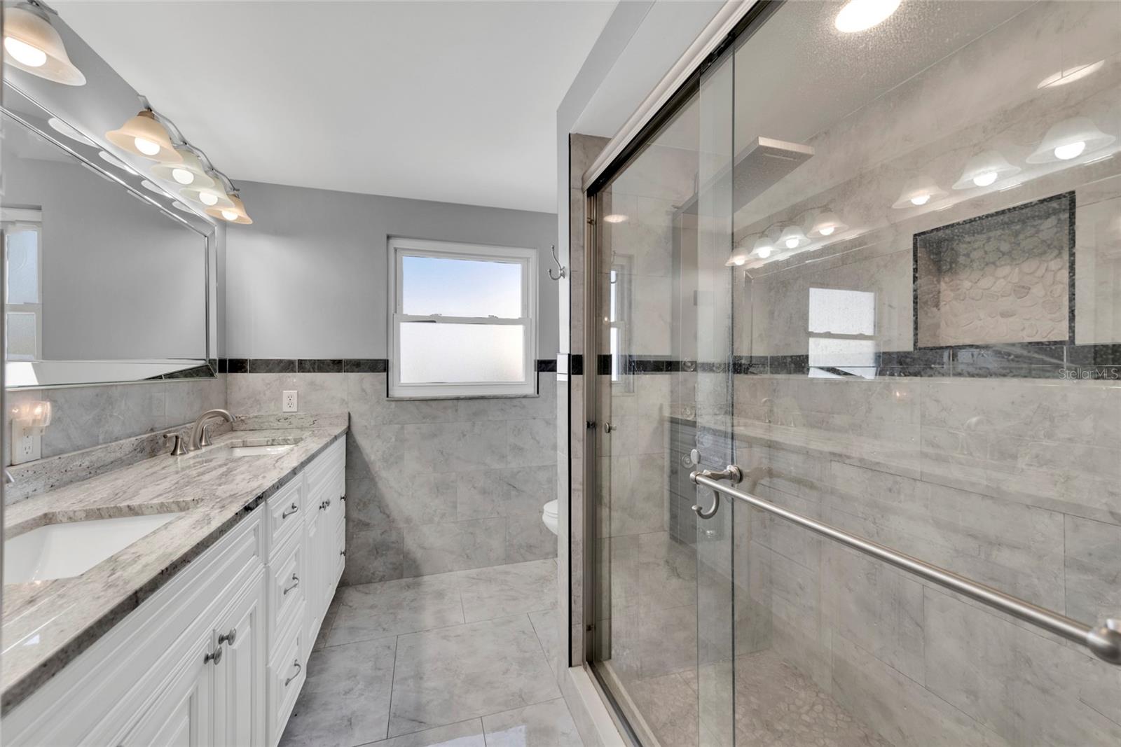 Primary EnSuite Bath ~ Dual Sinks ~ Stone ~ Updated Throughout