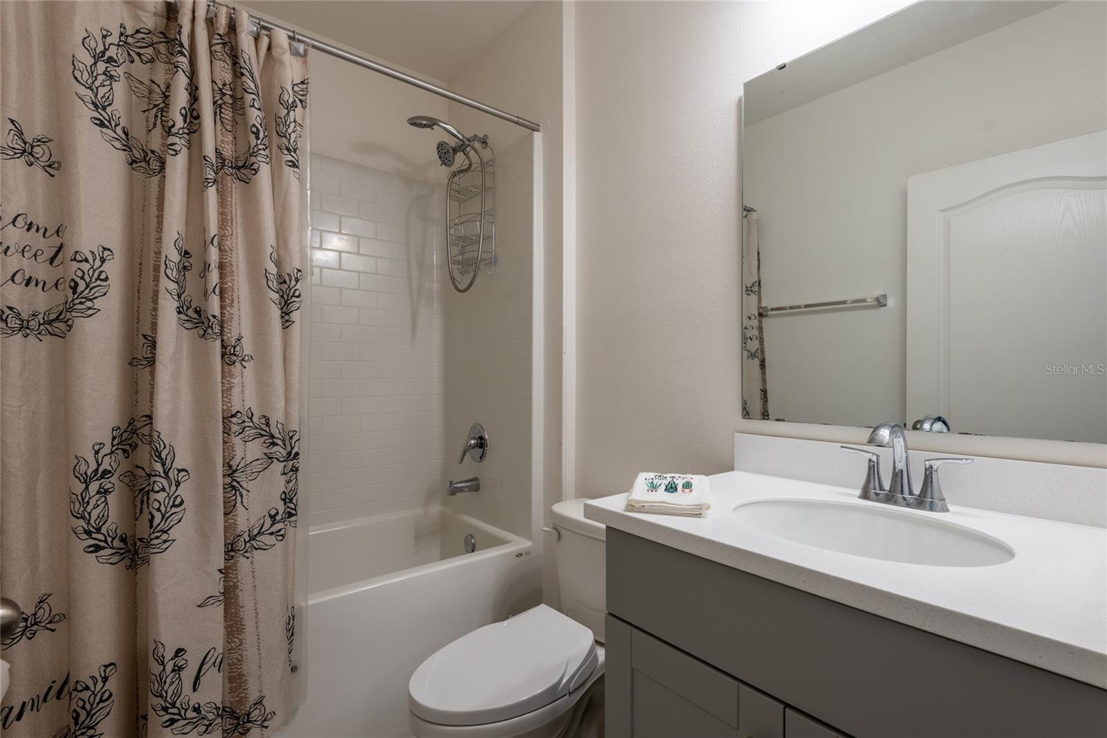 2nd bathroom with tub/shower combo. Shaker cabinets and quartz counter tops.