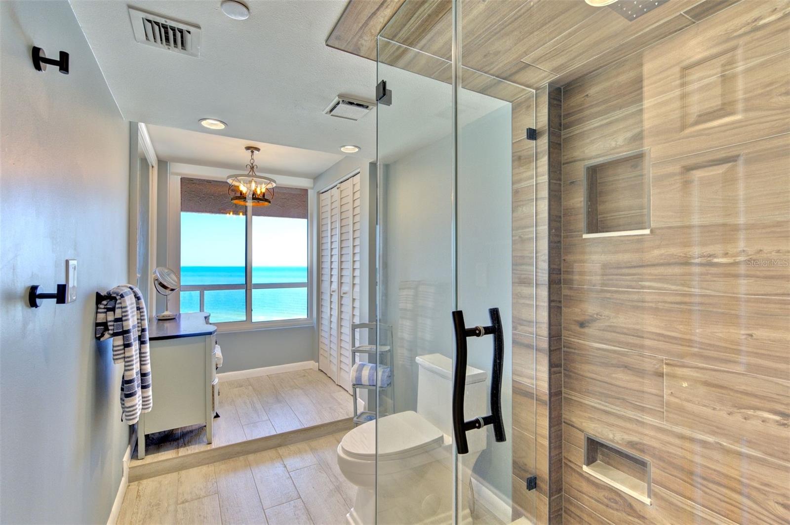 Primary ensuite bathroom with separate vanity space
