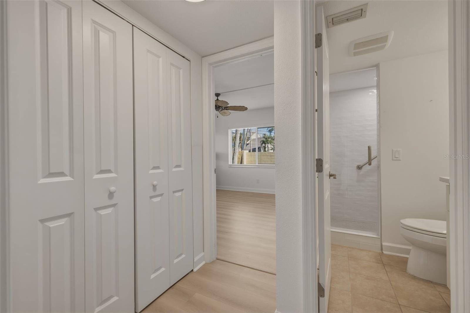 hallway to 2nd bedroom and 2nd full guest bathroom