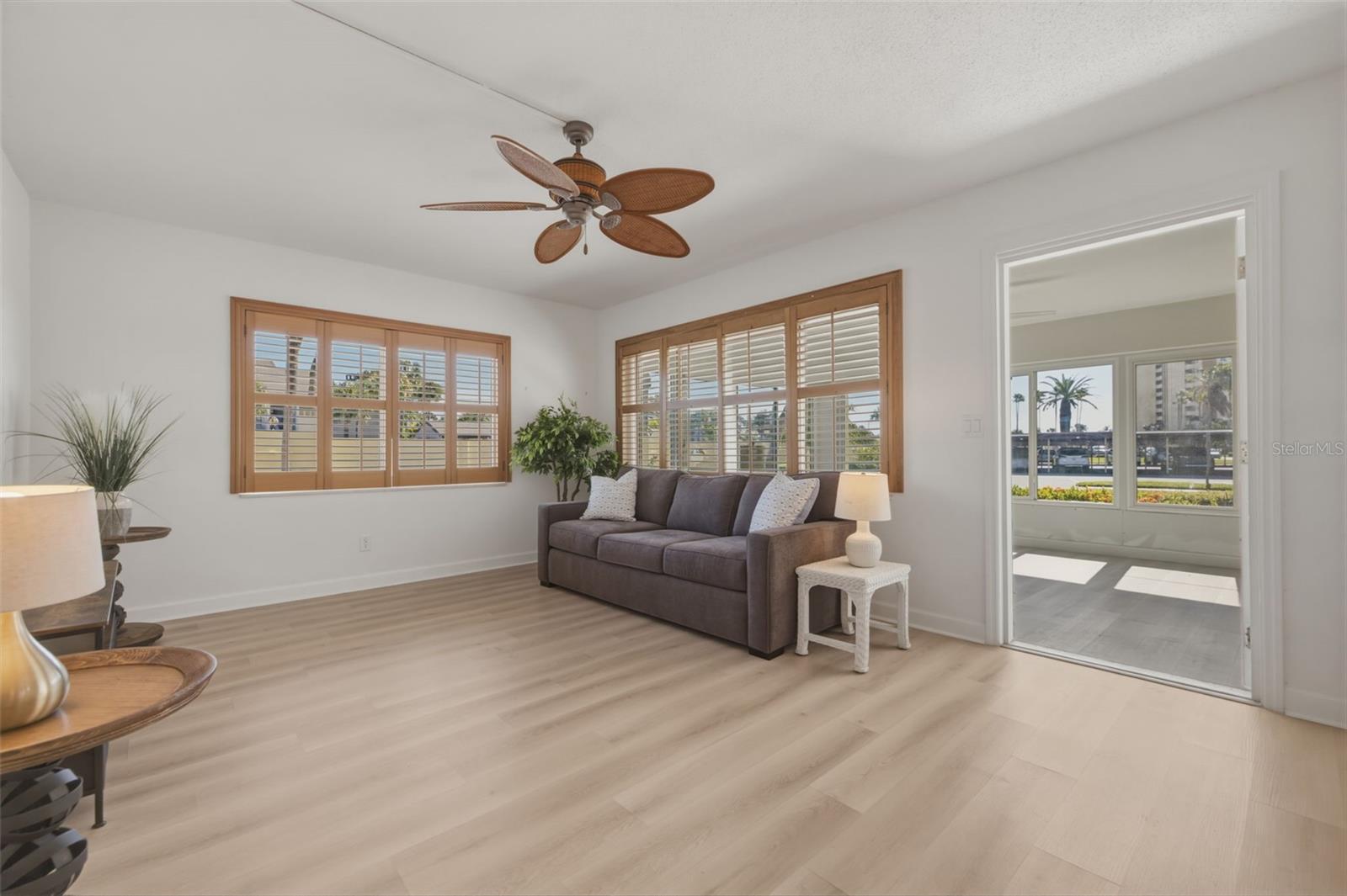 Entrance from the sunroom brings you into a spacious family room with end unit lighting throughout!!!