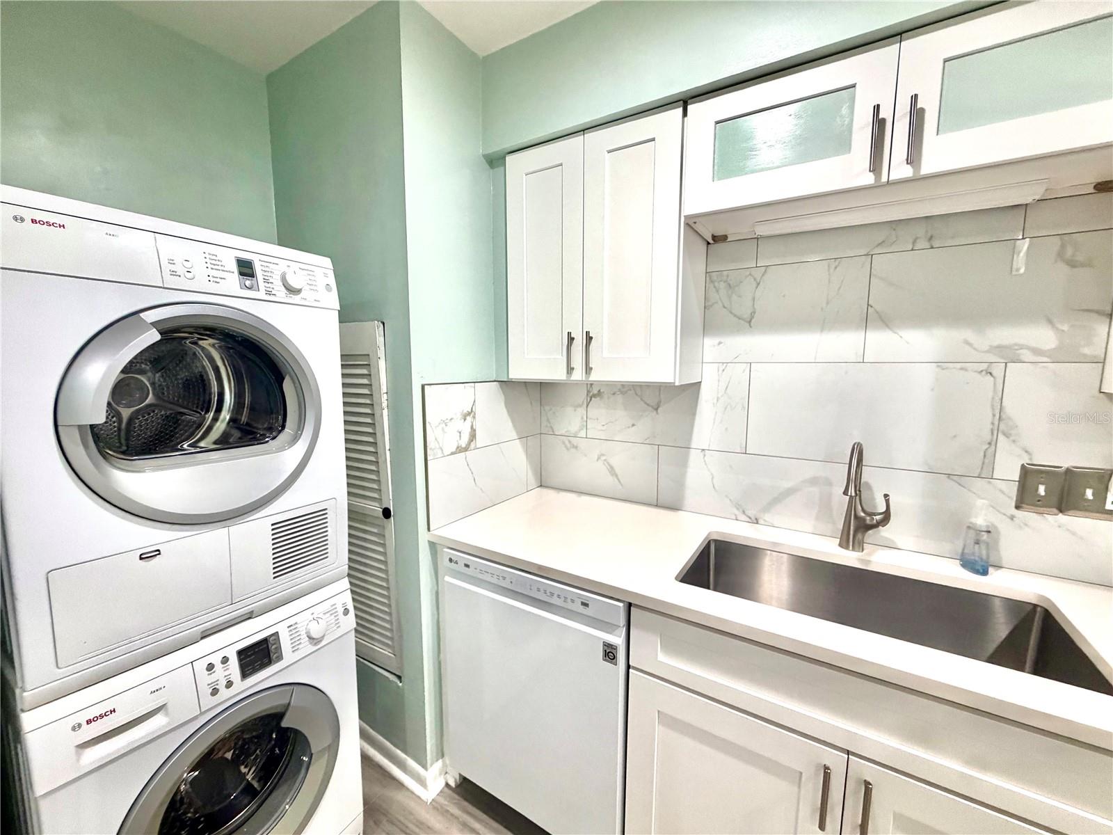 Washer and dryer is located in the kitchen