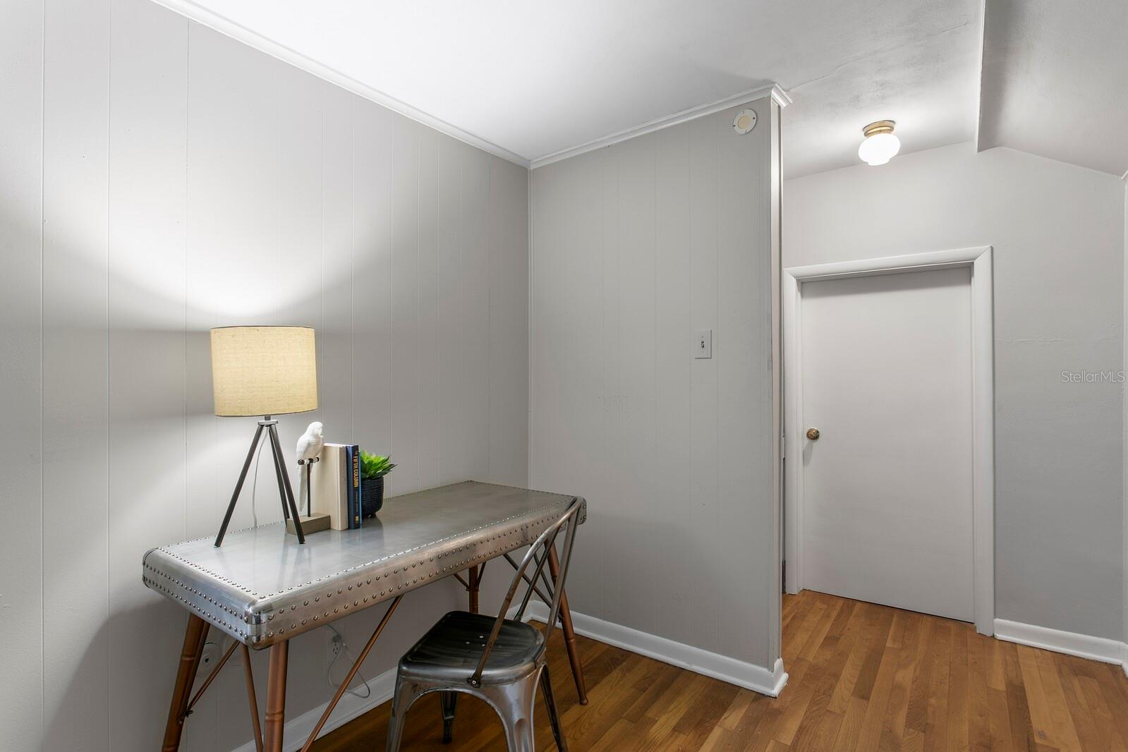 Upstairs Bonus room with the attic door, water heater is right there. Easy access.
