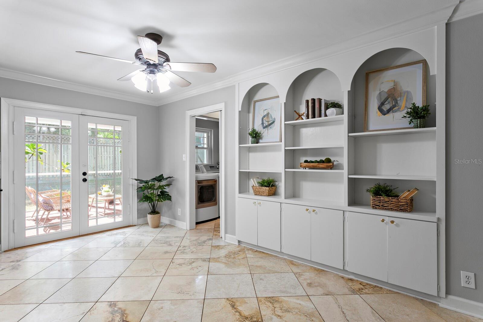 Laundry room is to the right and a bonus room up the stairs to the right of the laundry room.