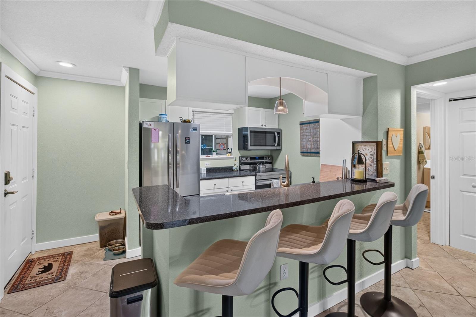 View of front door & kitchen