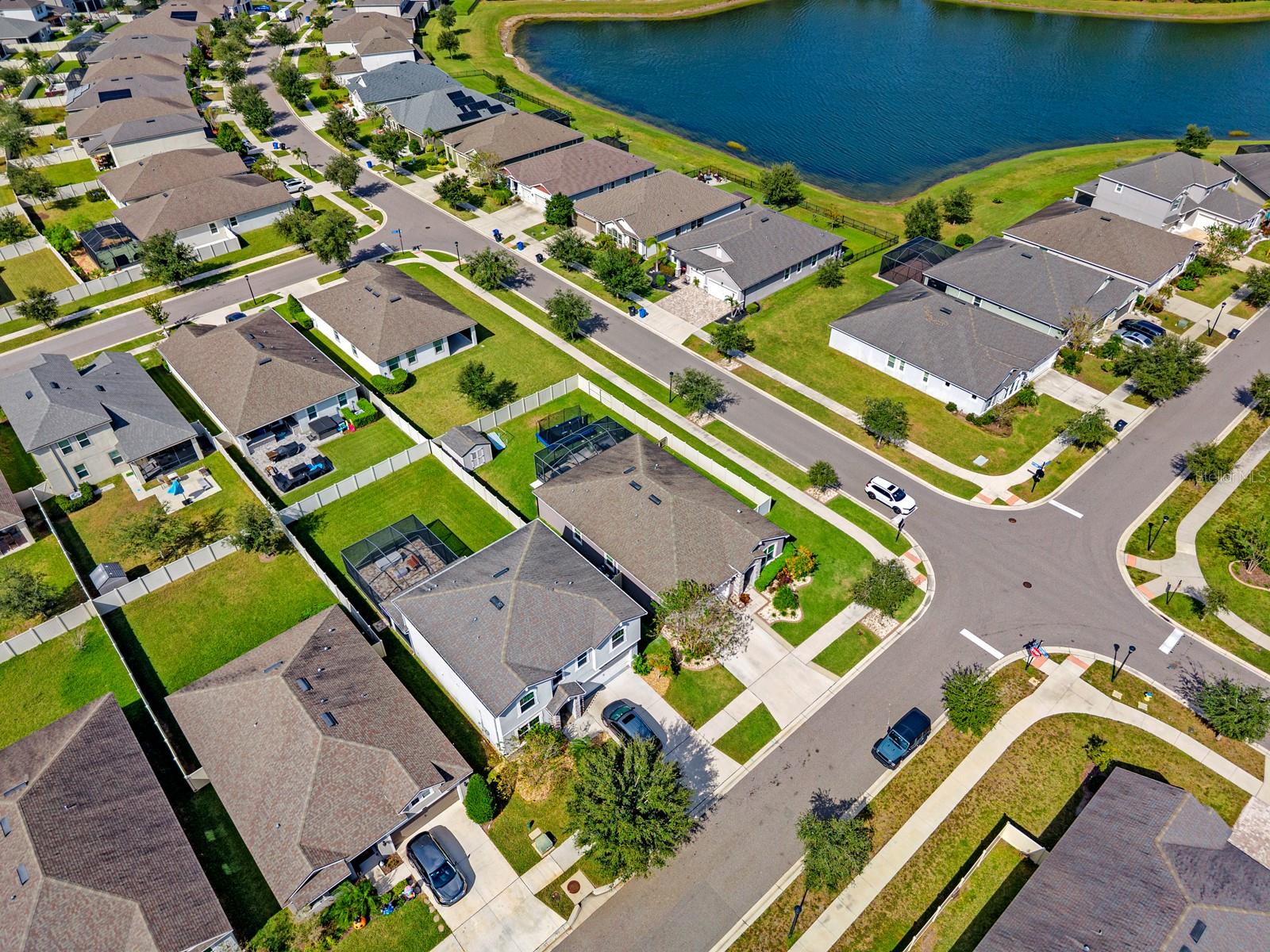 Aerial view of the neighborhood and nearby pond