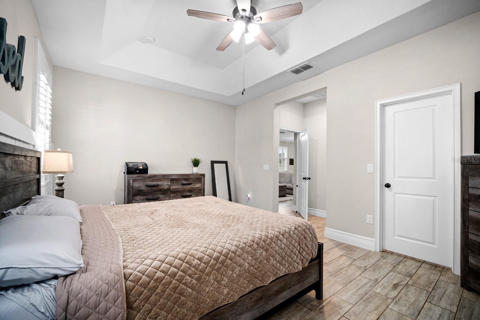 Primary bedroom with room for a king bed and walk-in closet access