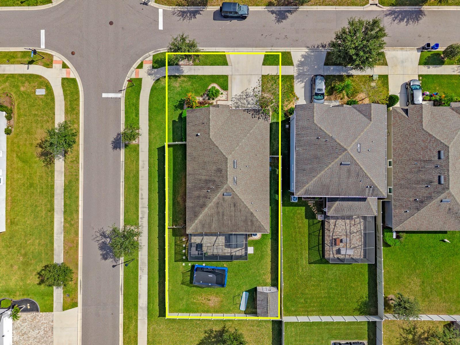 Overhead aerial showing the lot, roofline and street
