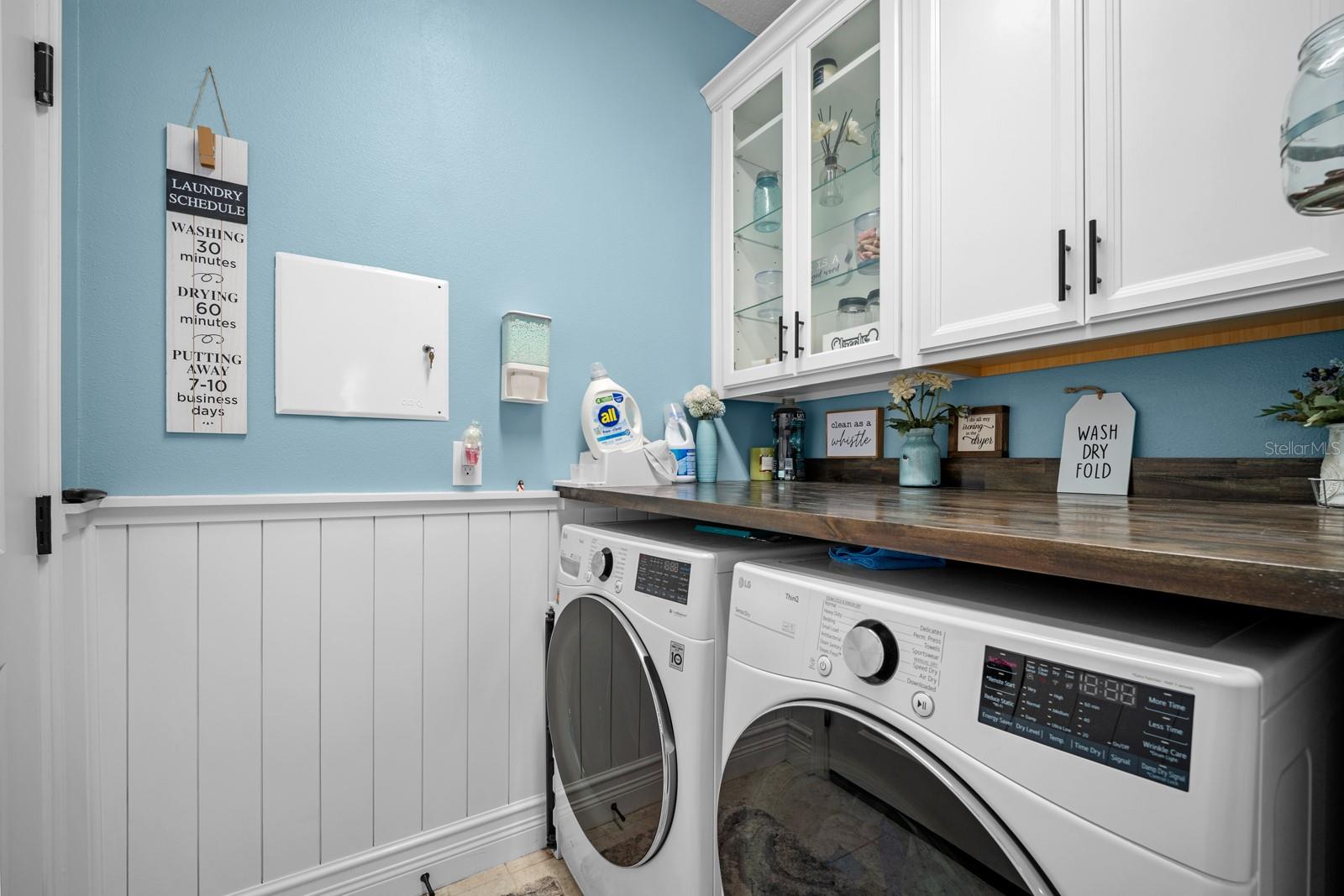 Laundry room with upper cabinets, butcher block counter and folding space-Washer Dryer do not convey.