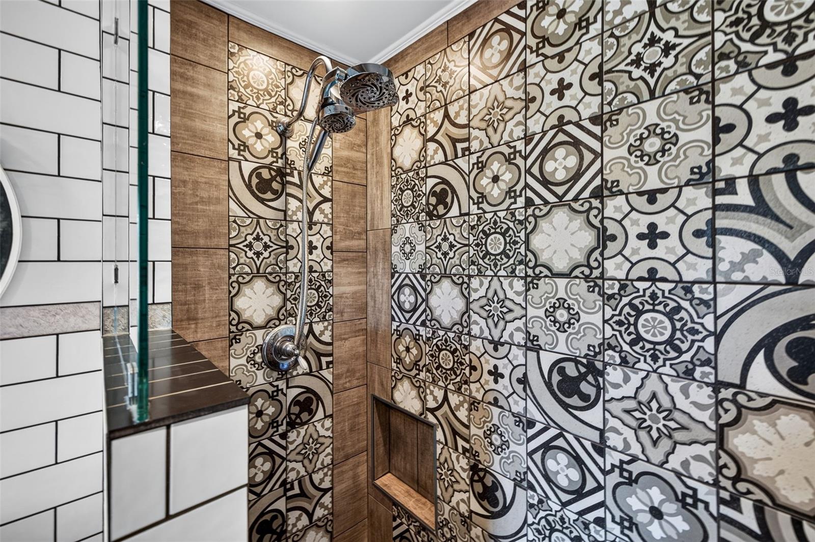 Primary bathroom with stand alone clawfoot tub, double shower head walk in shower, and double sink vanity