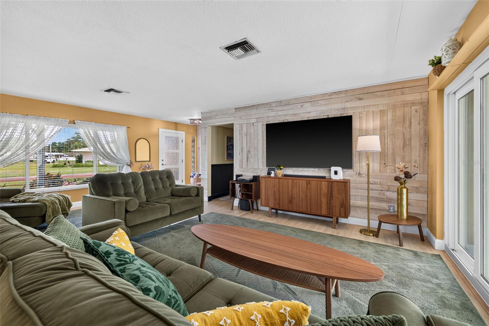 Foyer and living room with sliders to back porch