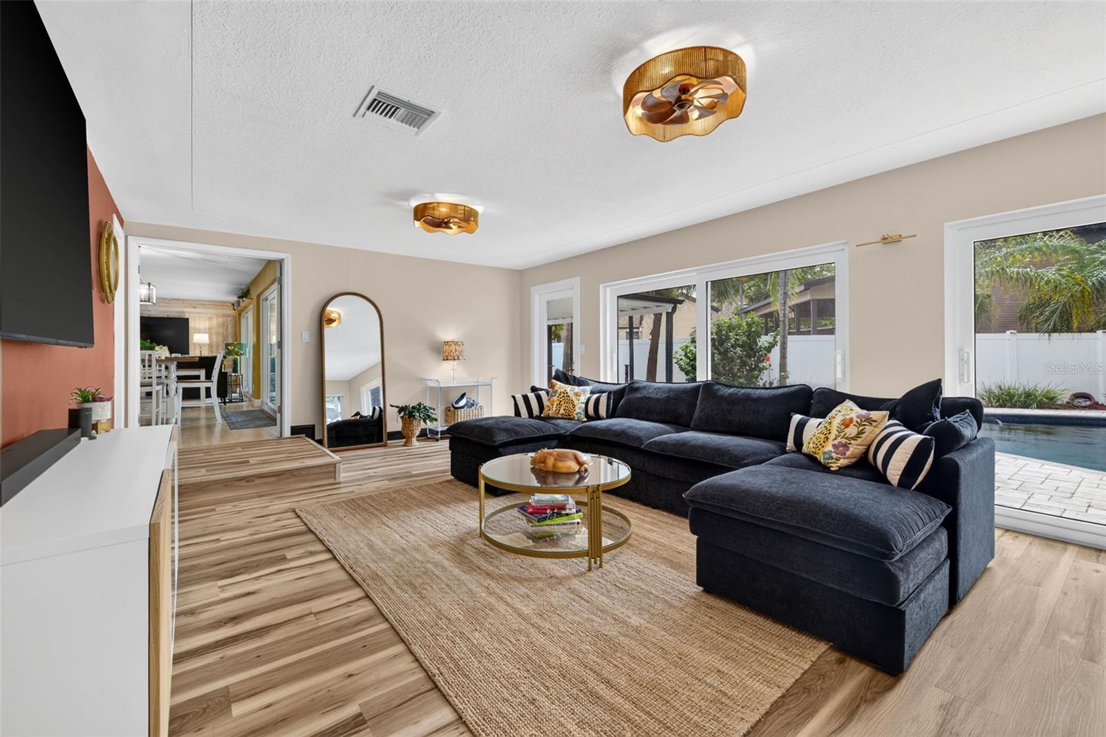 Family room with sliders to pool