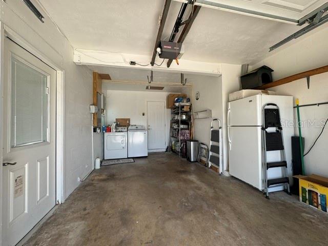 Washer and Dryer at back of the garage; 2nd refrigerator/freezer