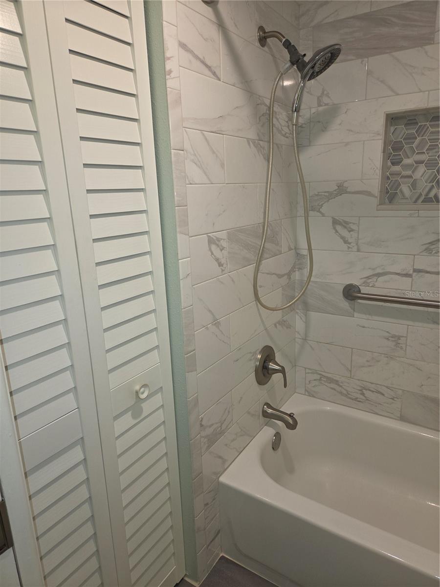 Primary bath has linen closet
