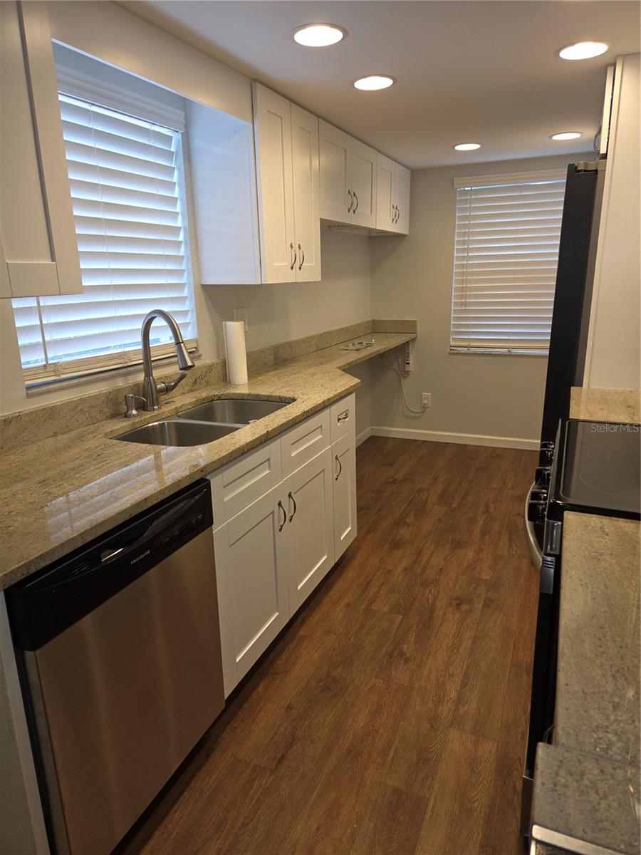 Beautifully updated kitchen with granite countertops and soft-close doors and drawers