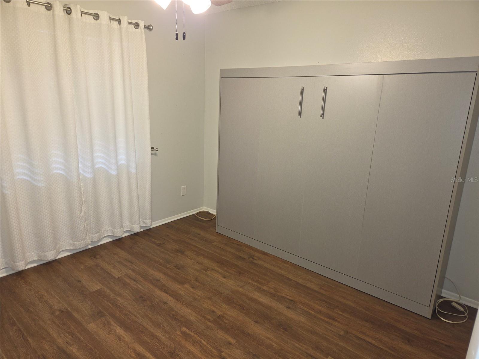 Guest bedroom with queen sized Murphy bed